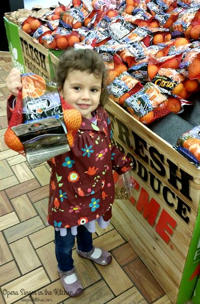 K picking oranges for salad