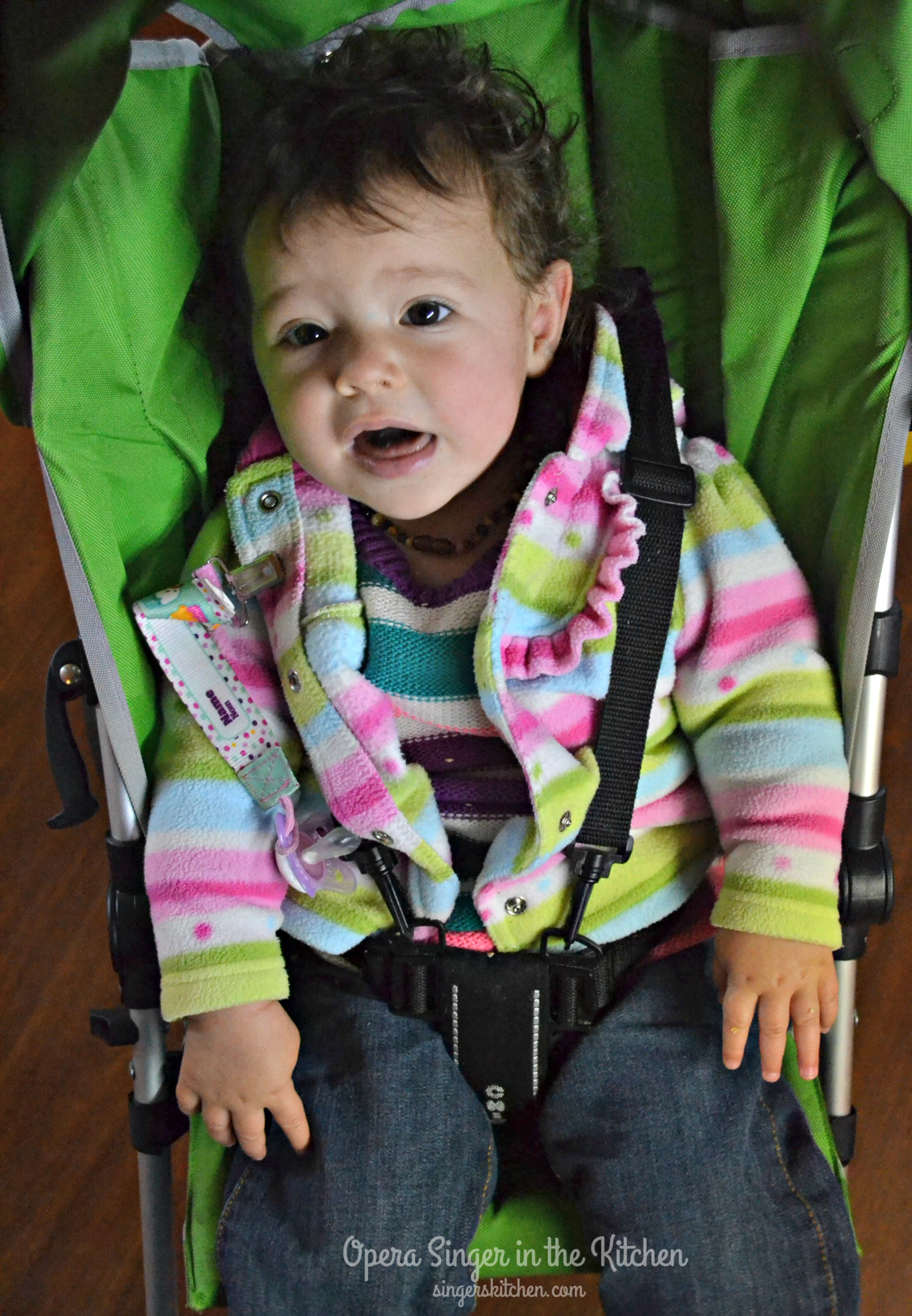 Tired baby in Chicco stroller